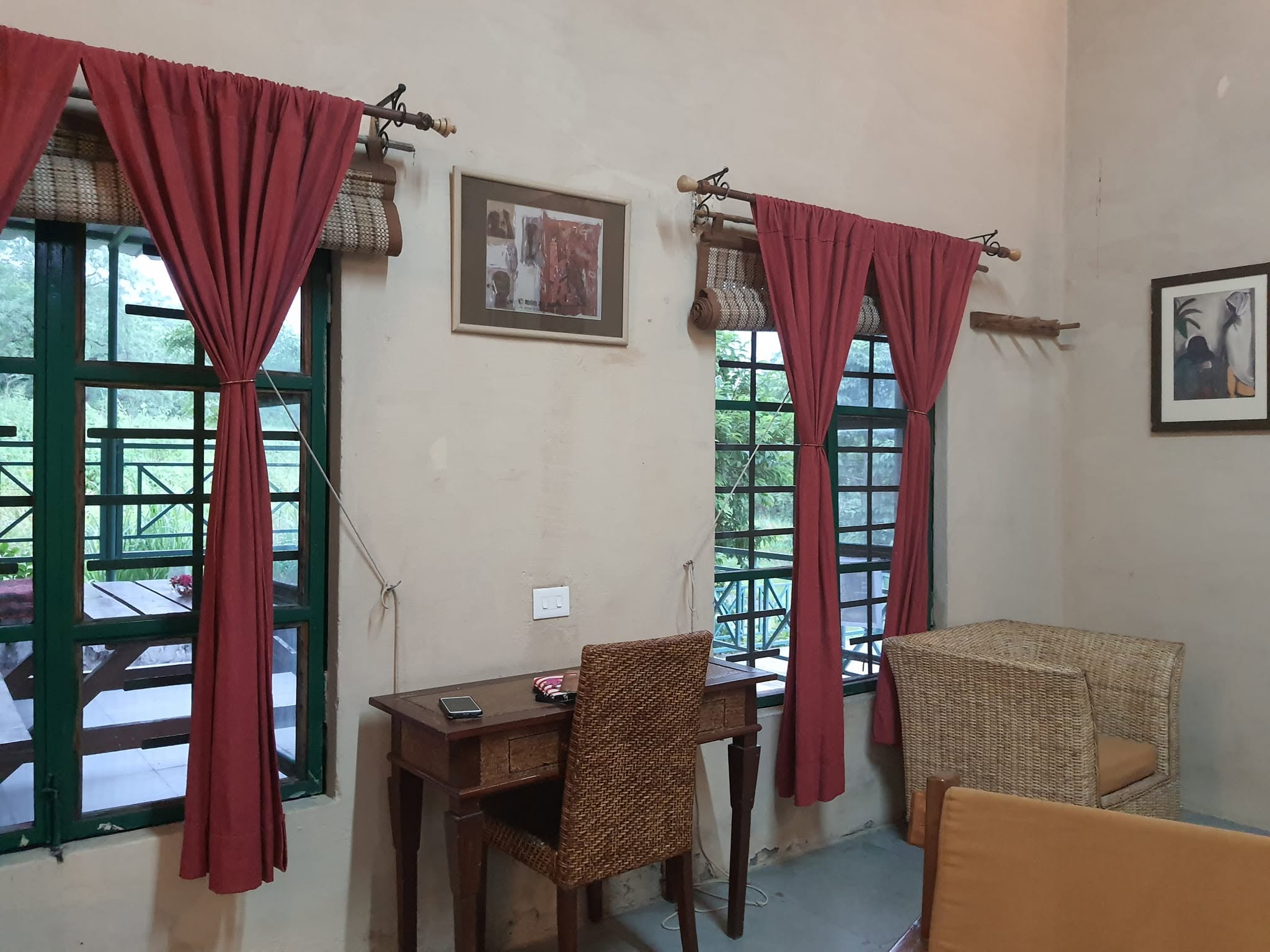 Forest view room with tall windows and writing desk
