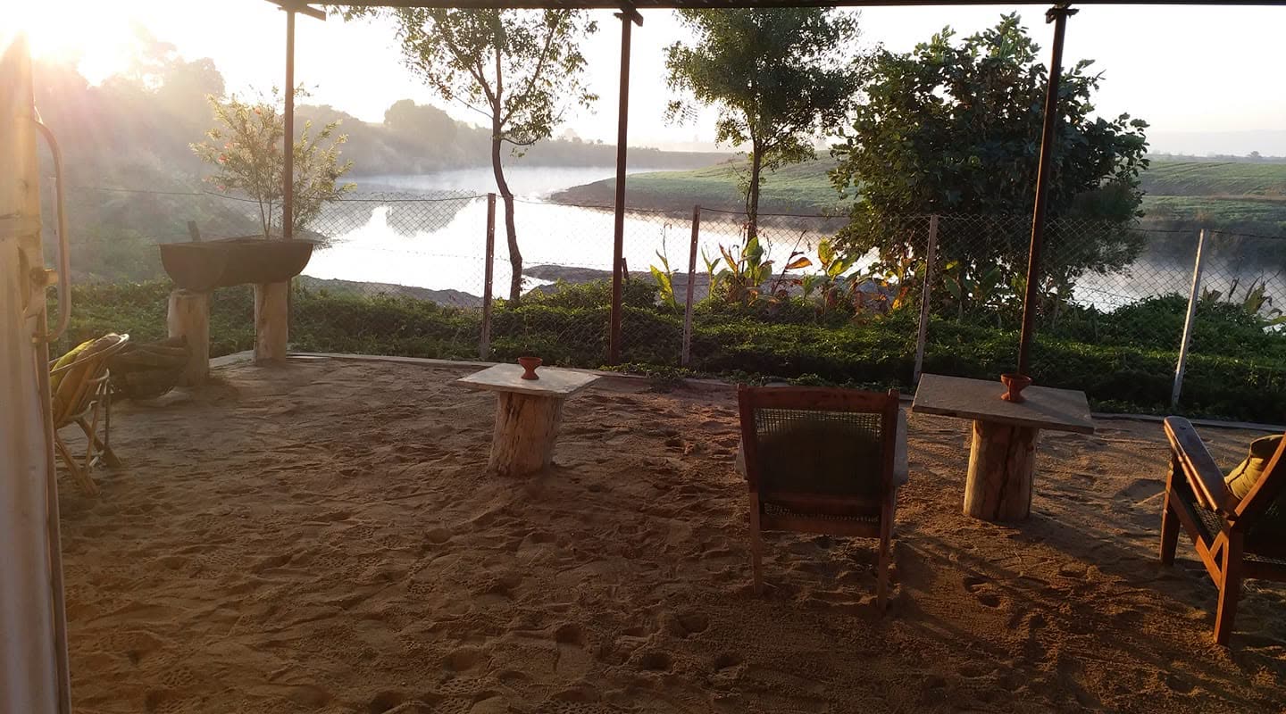 Seating set out above the water at dusk