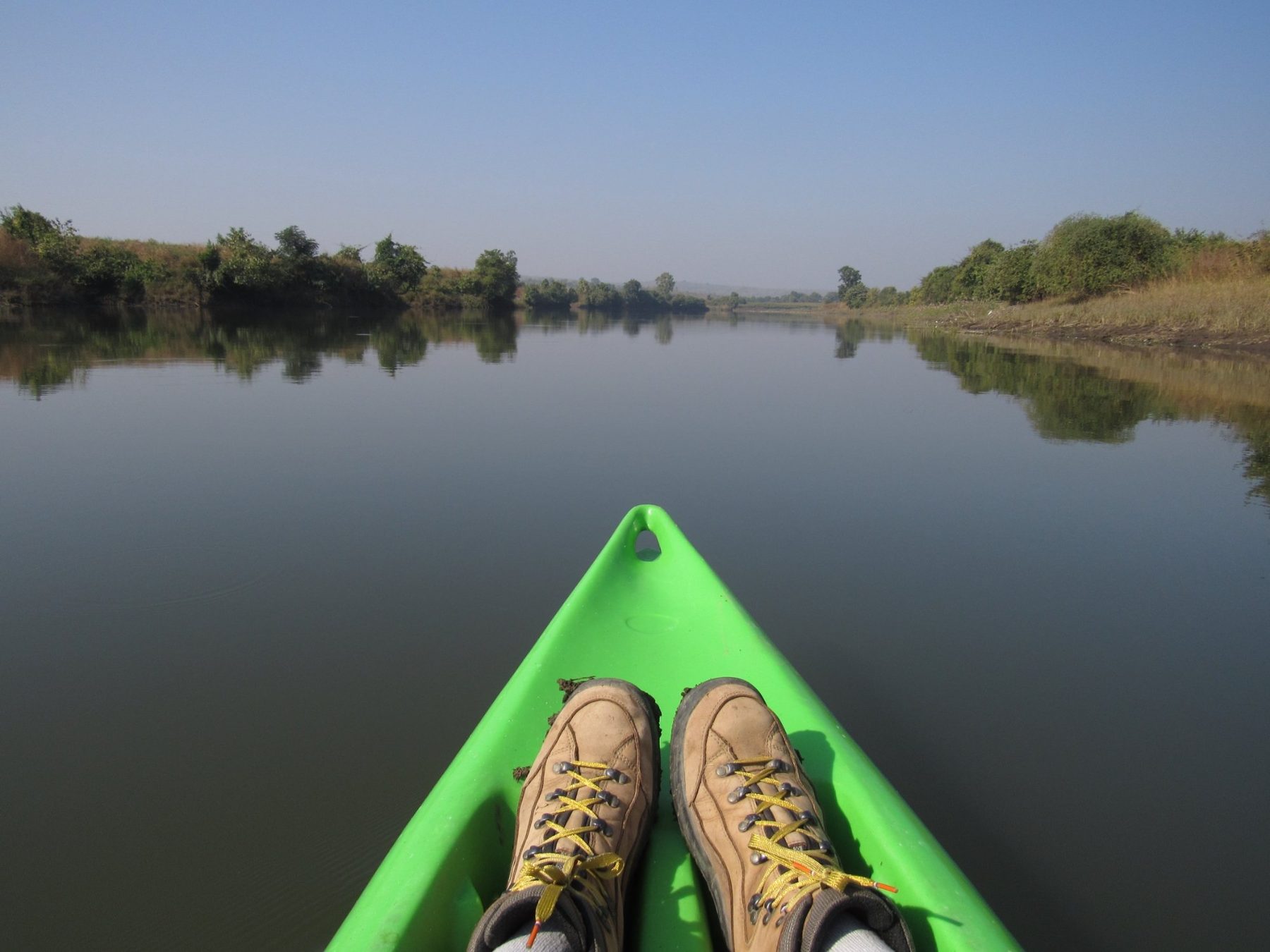 A canoe on the still water near the retreat