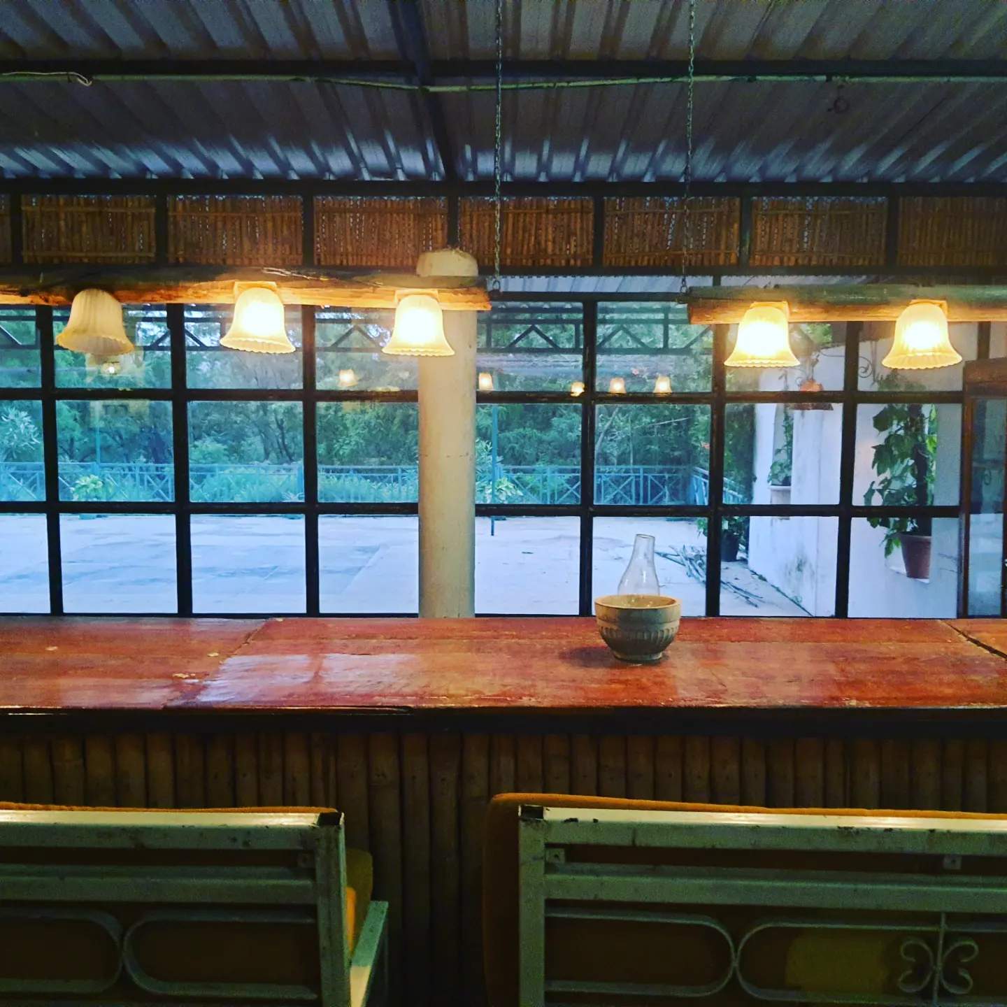 Dining hall with long counter and forest windows