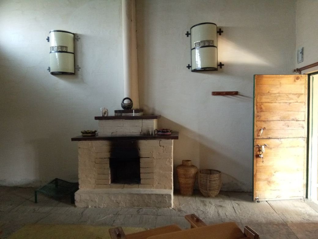 Guest room with a stone hearth