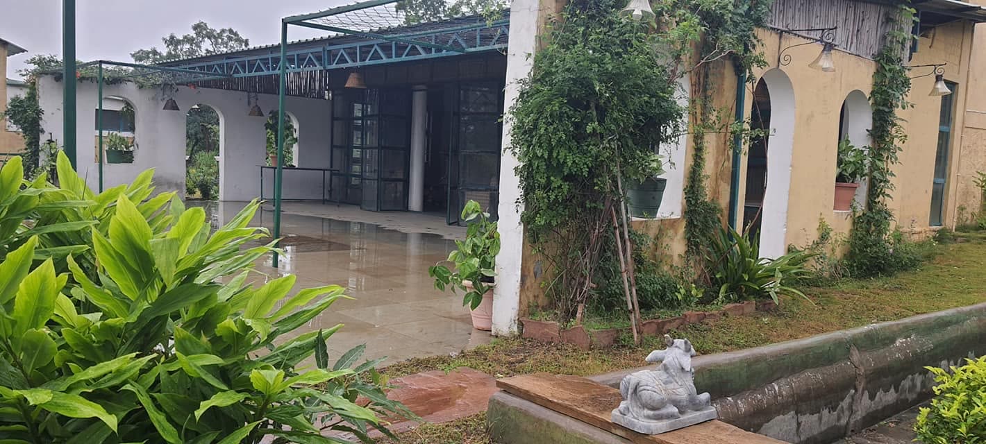Estate courtyard washed green after monsoon rain